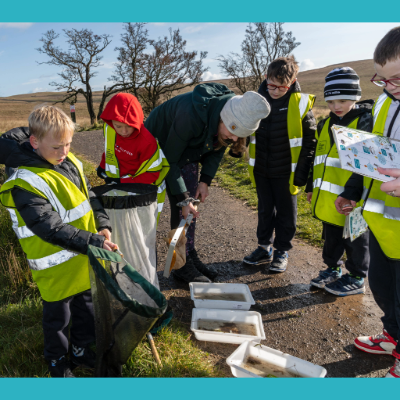 Group of School Children taking samples of the river
